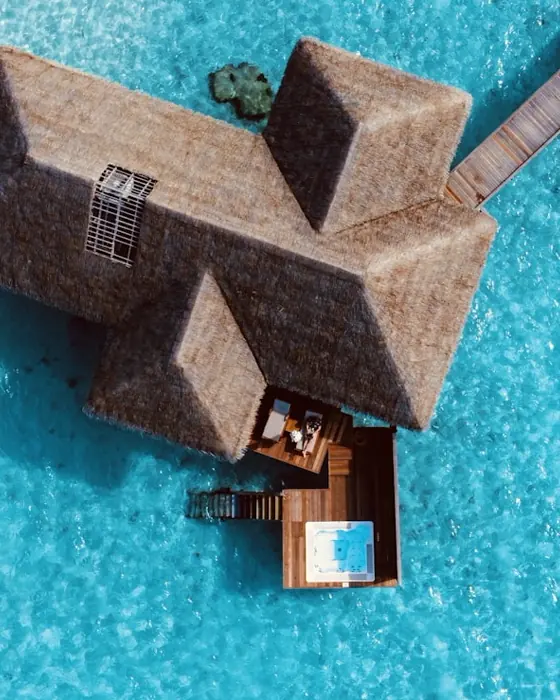 Overwater villa on a turquoise lagoon