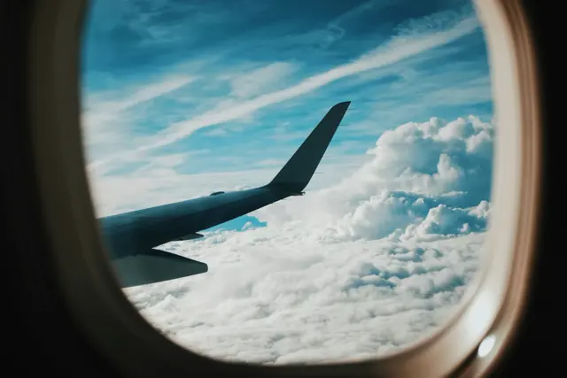 View of an aircraft wing above cloud